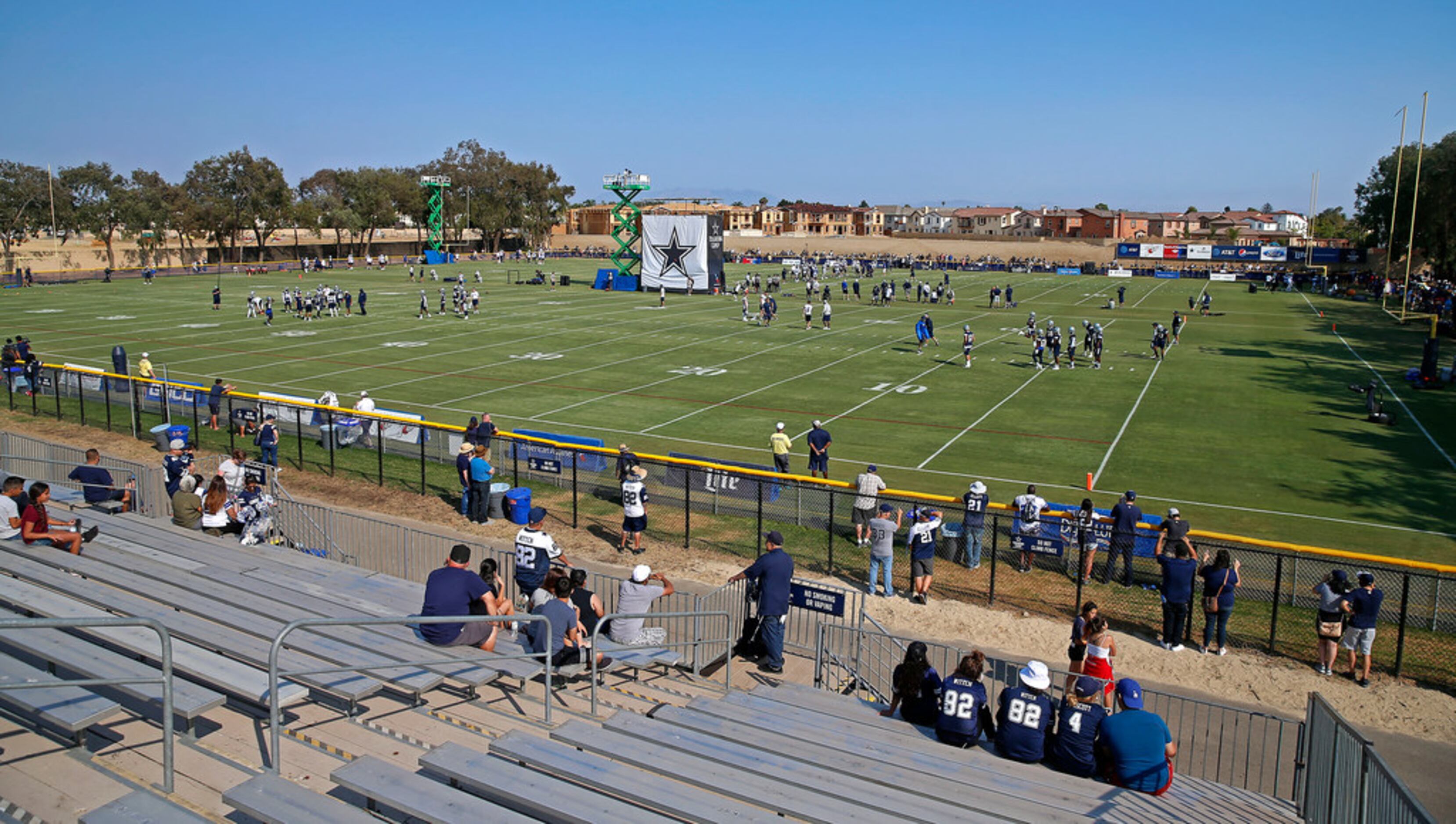 Cowboys practicing with simulated crowd noise in preparation for