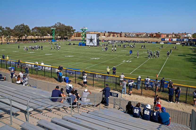 Cowboys fans watch afternoon practice at training camp in Oxnard, Calif., on Friday, July...