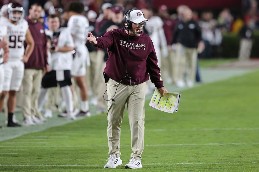 Texas A&M coach Jimbo Fisher gestures during the first half of the team's NCAA college...