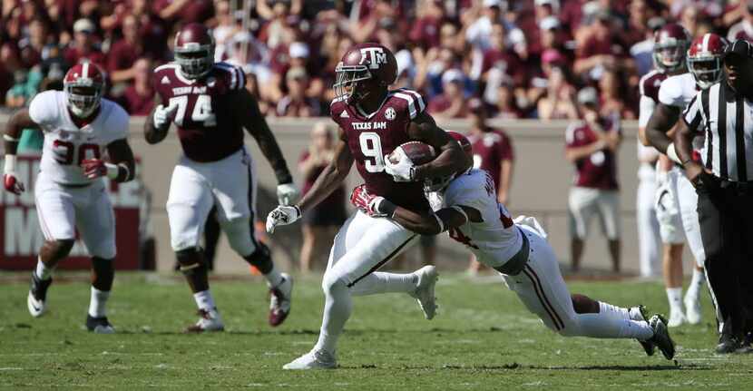 Texas A&M Aggies wide receiver Ricky Seals-Jones (9) is tackled by Alabama Crimson Tide...