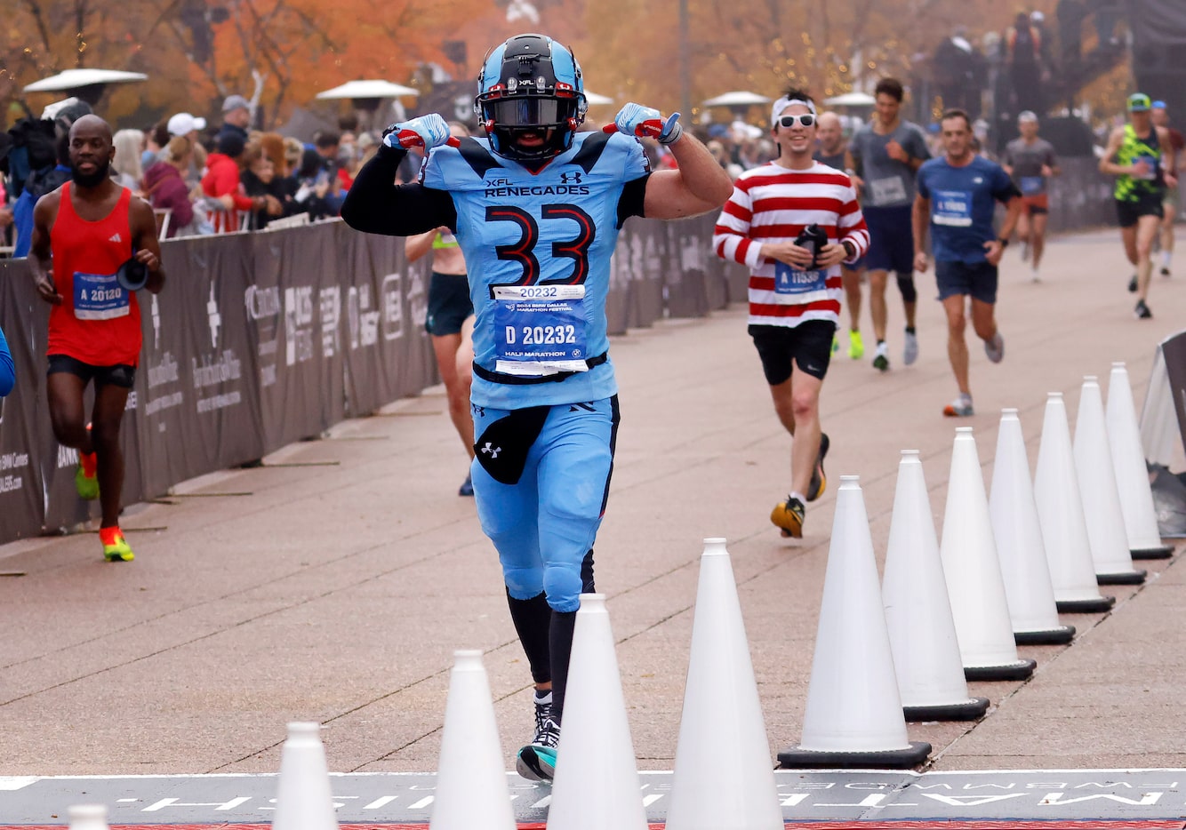 Brian Goldsmith, wearing the Dallas Renegades football uniform for the second year, crosses...