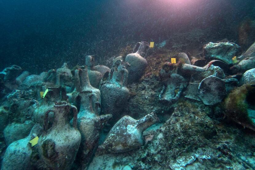 Ancient amphoras, or vases, line the sea floor at the site of the shipwreck, which dates to...