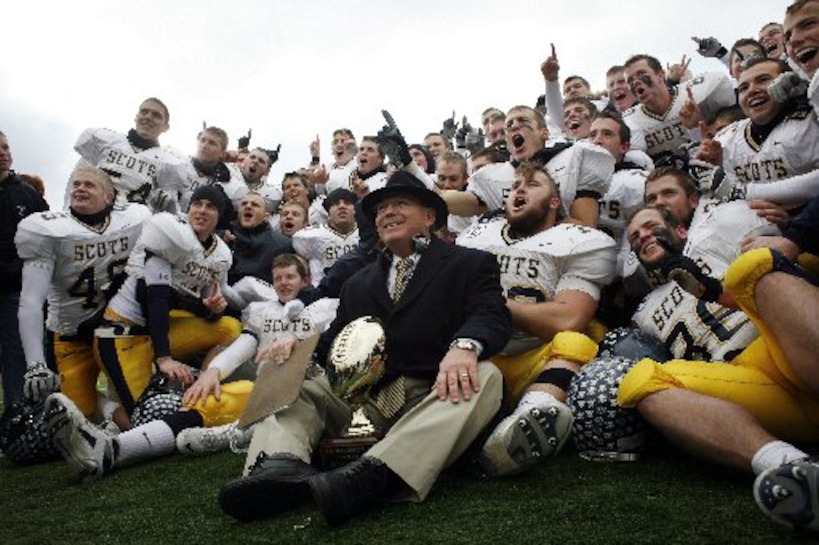 12/15/07 -- Coach Randy Allen and the Highland Park football team celebrate their victory...