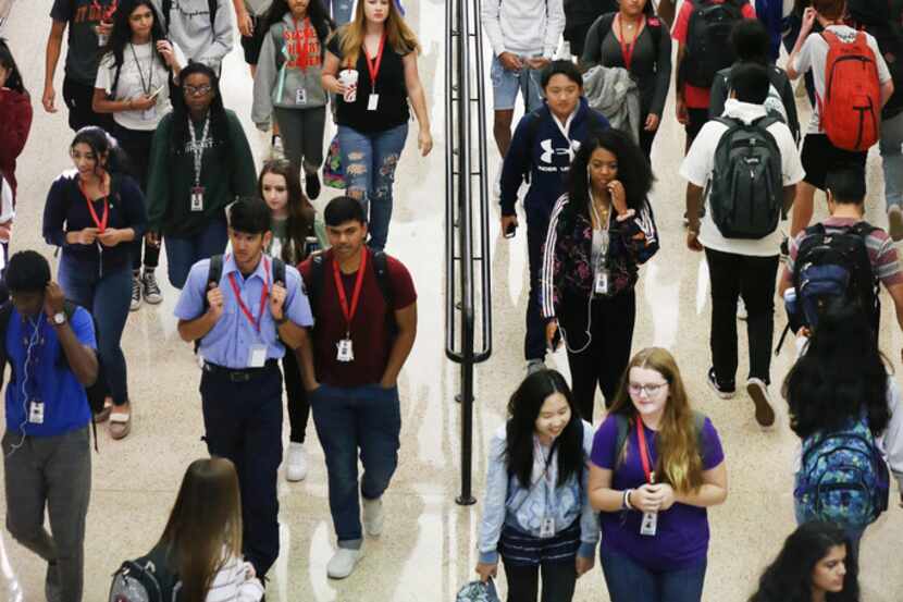 Students walk to class at Frisco ISD's Liberty High School in Frisco, Texas on Thursday,...