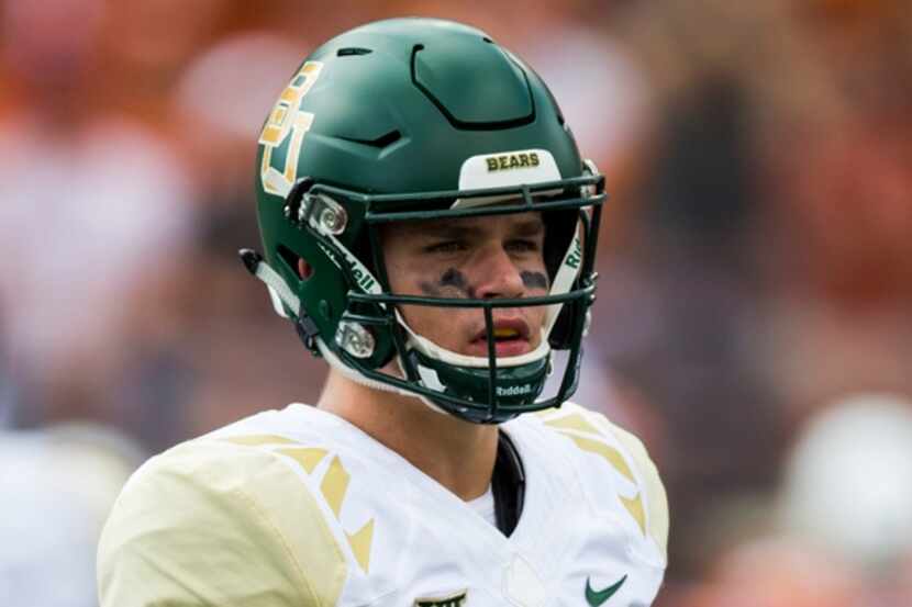 Baylor Bears quarterback Charlie Brewer (12) looks for the play call during the first...