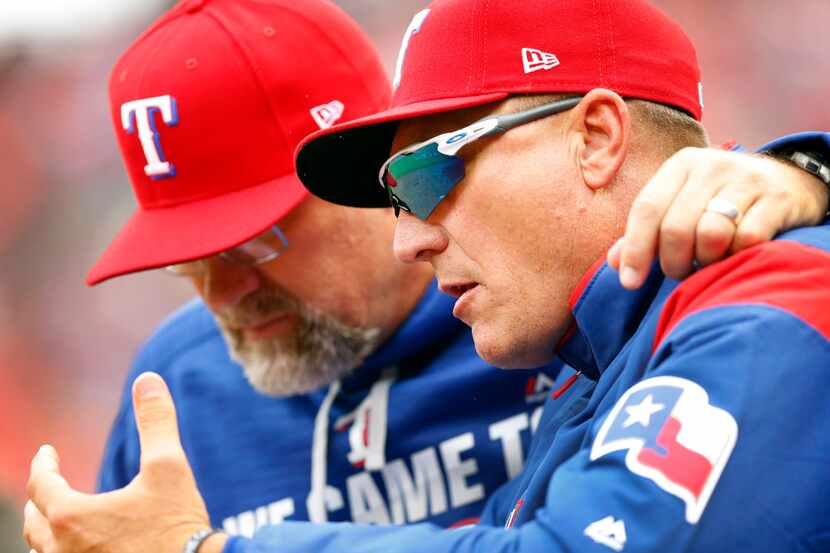 Texas Rangers manager Jeff Banister (right) confers with pitching coach Doug Brocail during...