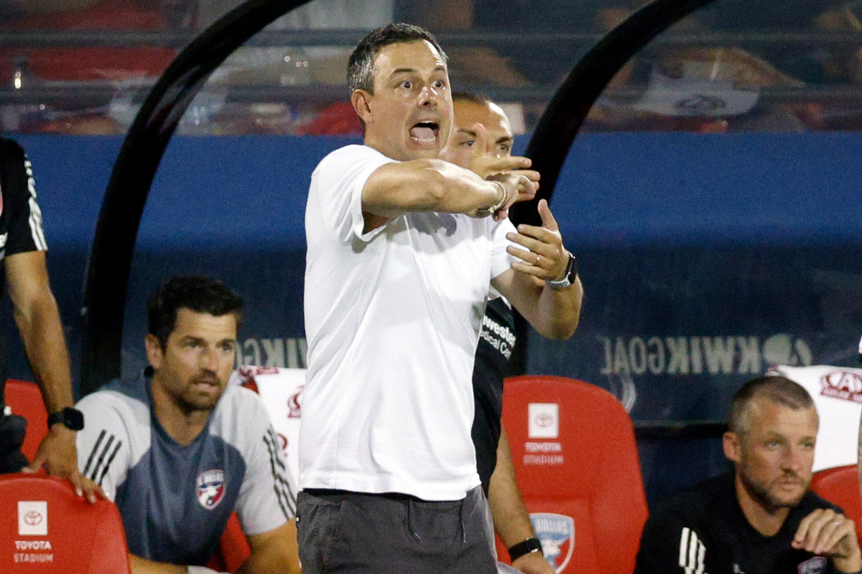 FC Dallas head coach Nico Estevez calls for a foul after forward Bernard Kamungo (77)...