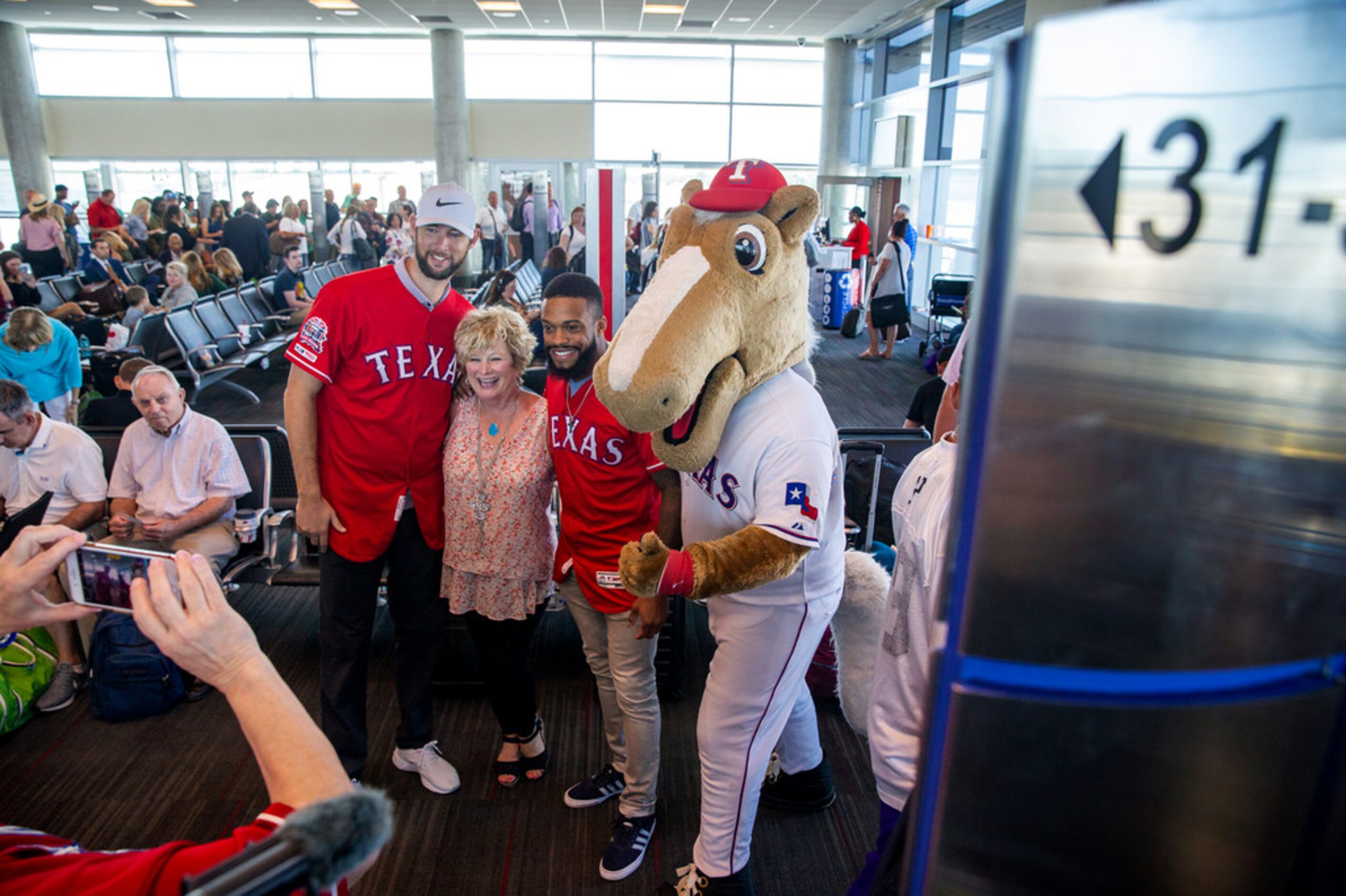 Rangers Captain (right) and Texas Rangers players Chris Martin (left) and Delino DeShields...