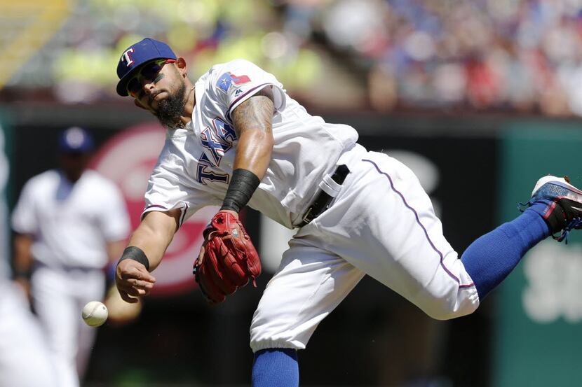 Texas Rangers second baseman Rougned Odor (12) throws to Texas Rangers first baseman Mitch...