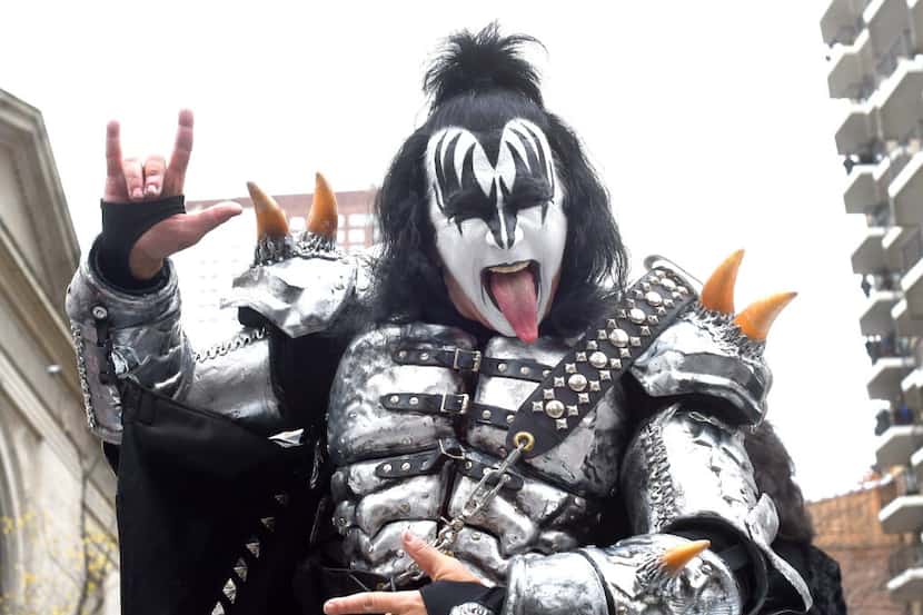 Gene Simmons of Kiss sticks his tongue out as the band comes down Central Park West during...