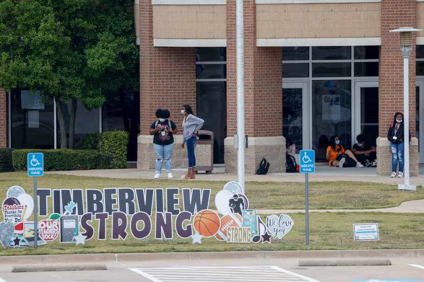 Students from Timberview High School leave campus after class Tuesday in Arlington. Students...
