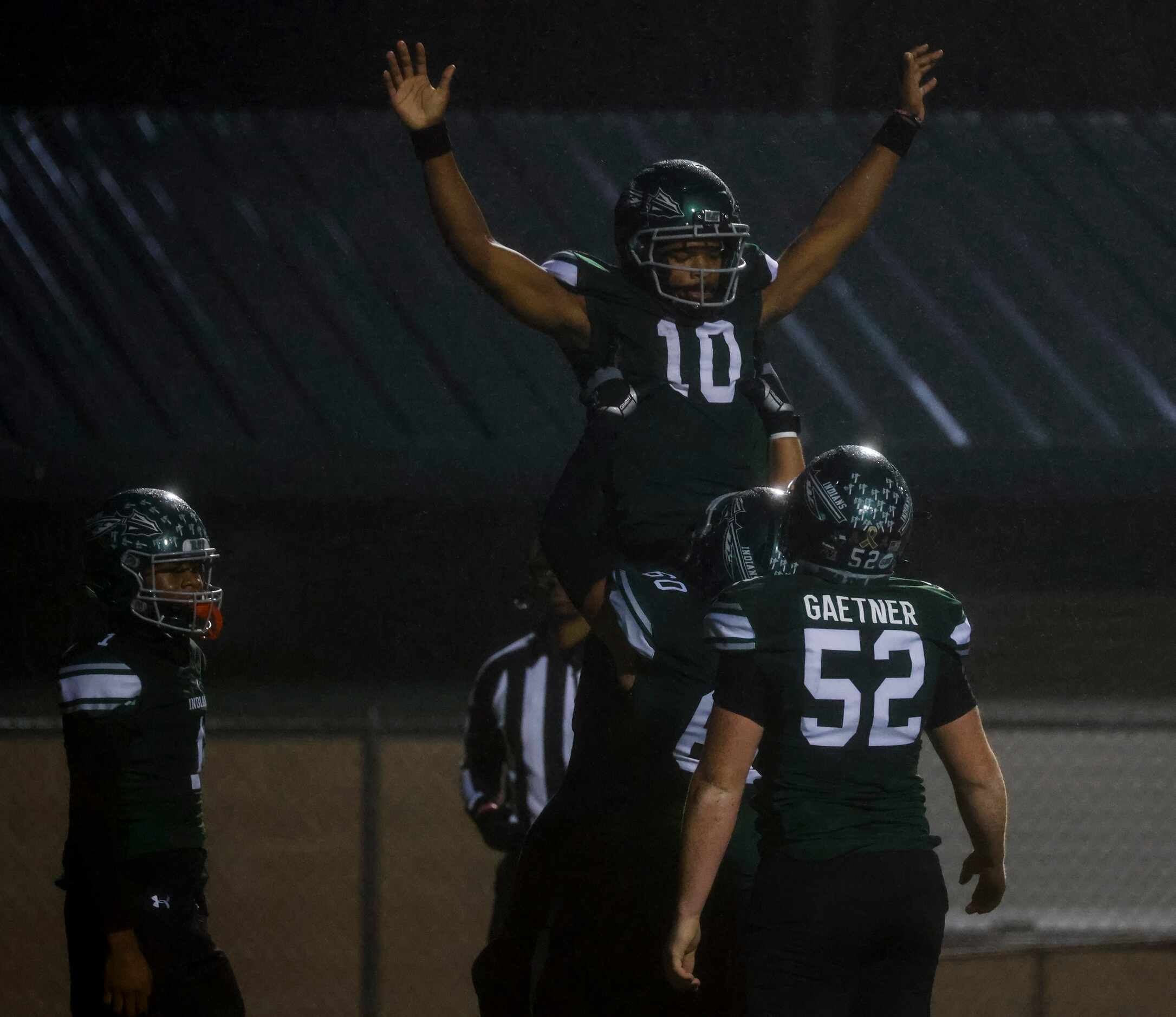 Waxahachie High School’s Roderick Hartsfield Jr. (10), celebrates a touchdown against...