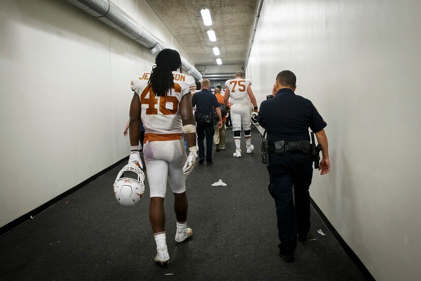 Texas linebacker Malik Jefferson (46) heads toward the locker room following a loss to TCU...