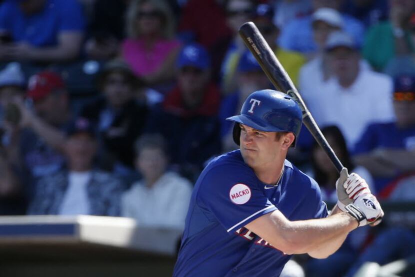 Texas Rangers outfielder Jared Hoying in an at bat during a Major League Baseball spring...