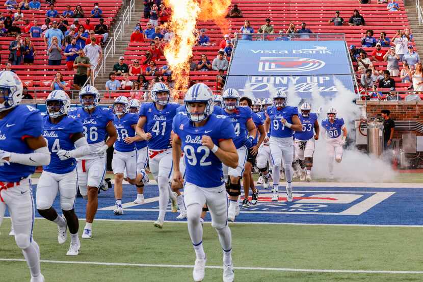 SMU takes the field before an NCAA football game against Prairie View A&M at Ford Stadium on...