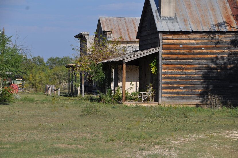 Deteriorating buildings at the Alamo Village site.