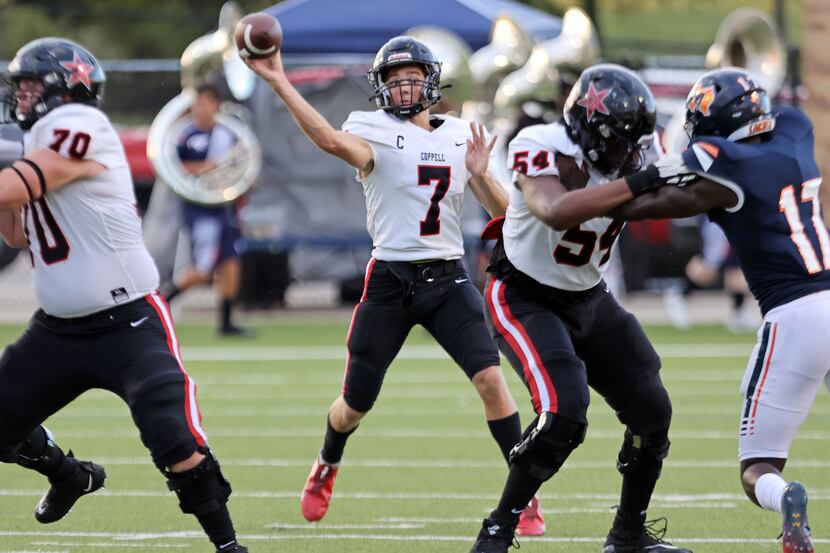 Coppell QB Jack Fishpaw (7) looks for a receiver during the first half of a high school...