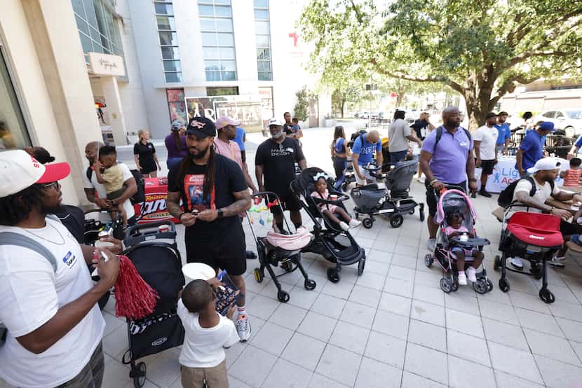 Community members meet during a Daddy Stroller Social Club event at Legacy West in Plano on...
