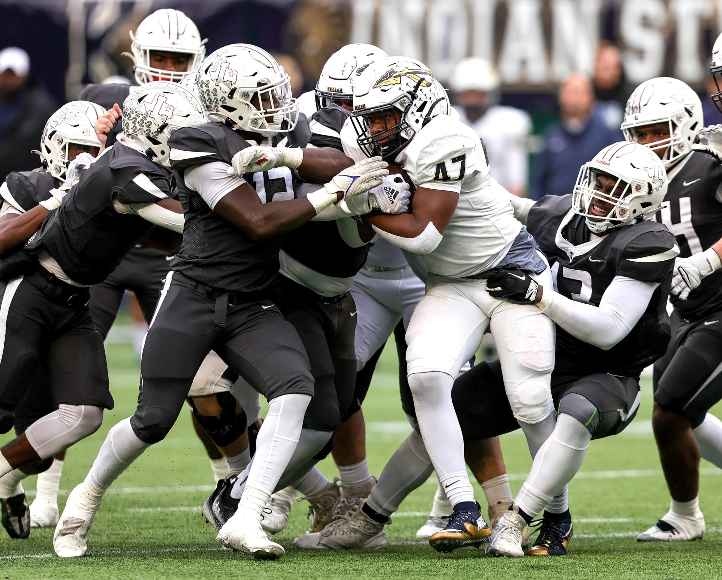 Keller running back Jayden Hart (47) gets stuffed by the Lewisville defense during the first...