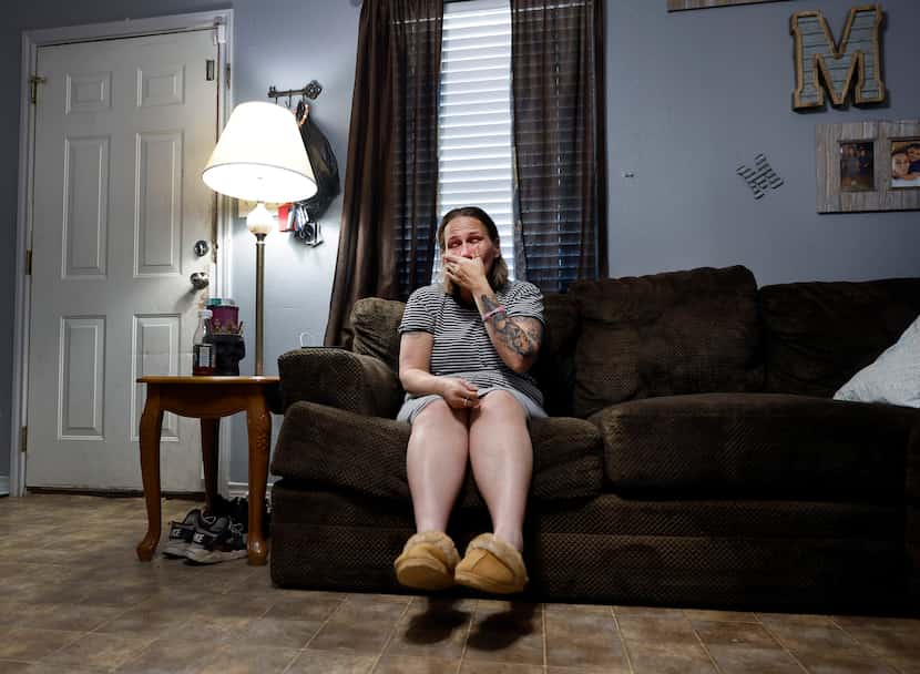 Silvia Martinez wipes away tears in her living room as she speaks about her 19-year-old...