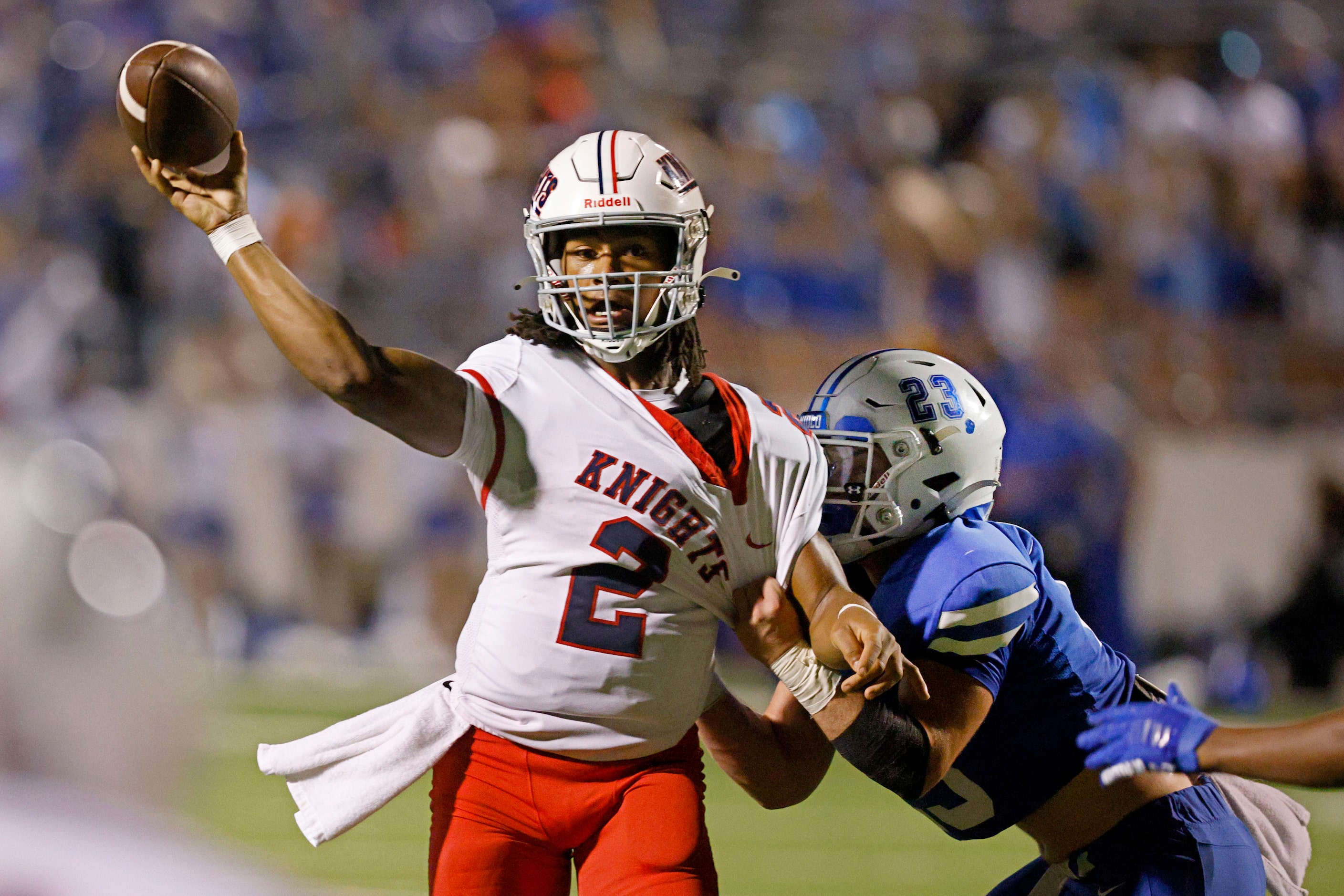 Kimball's  quarterback Armirie Williams-Hall (2) passes under pressure from Midlothian's...