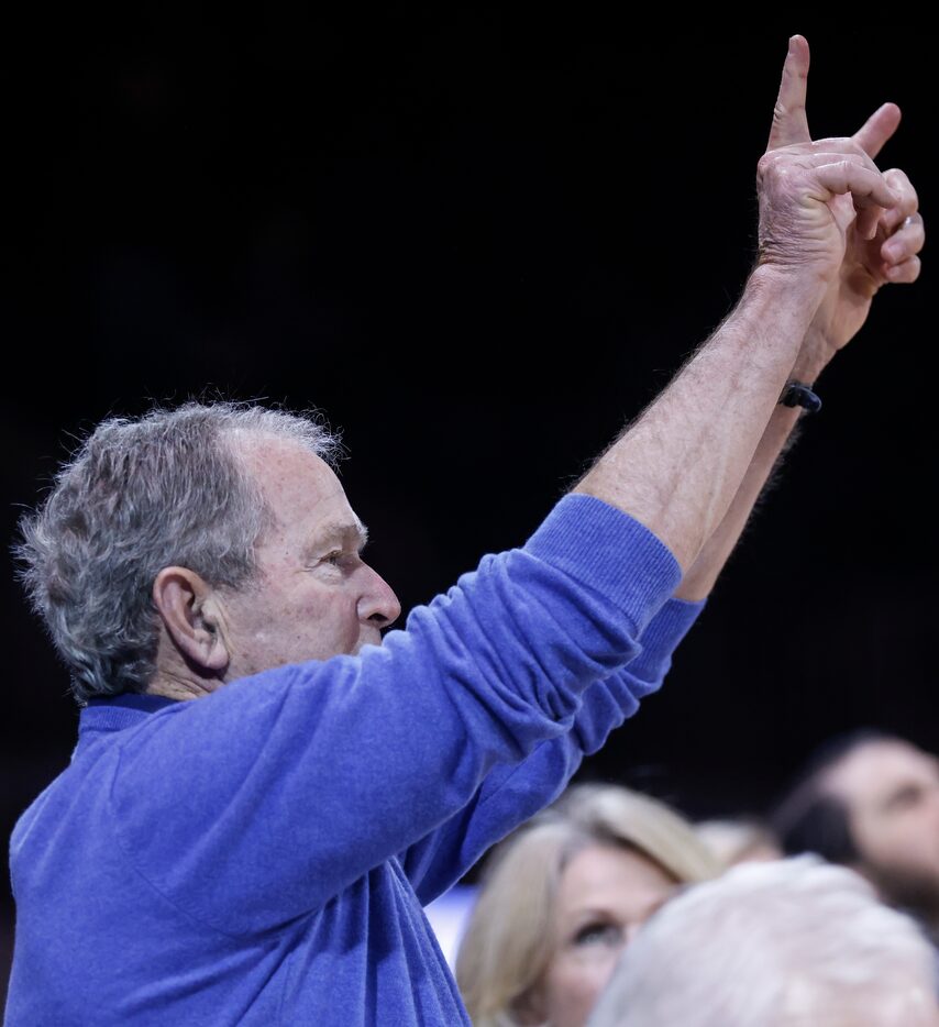 Former President George W. Bush stands during the game against Tulsa Golden Hurricane on...