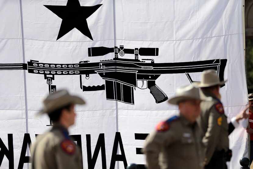 Texas State Troopers watched over a rally in support of open carry gun laws at the Capitol...