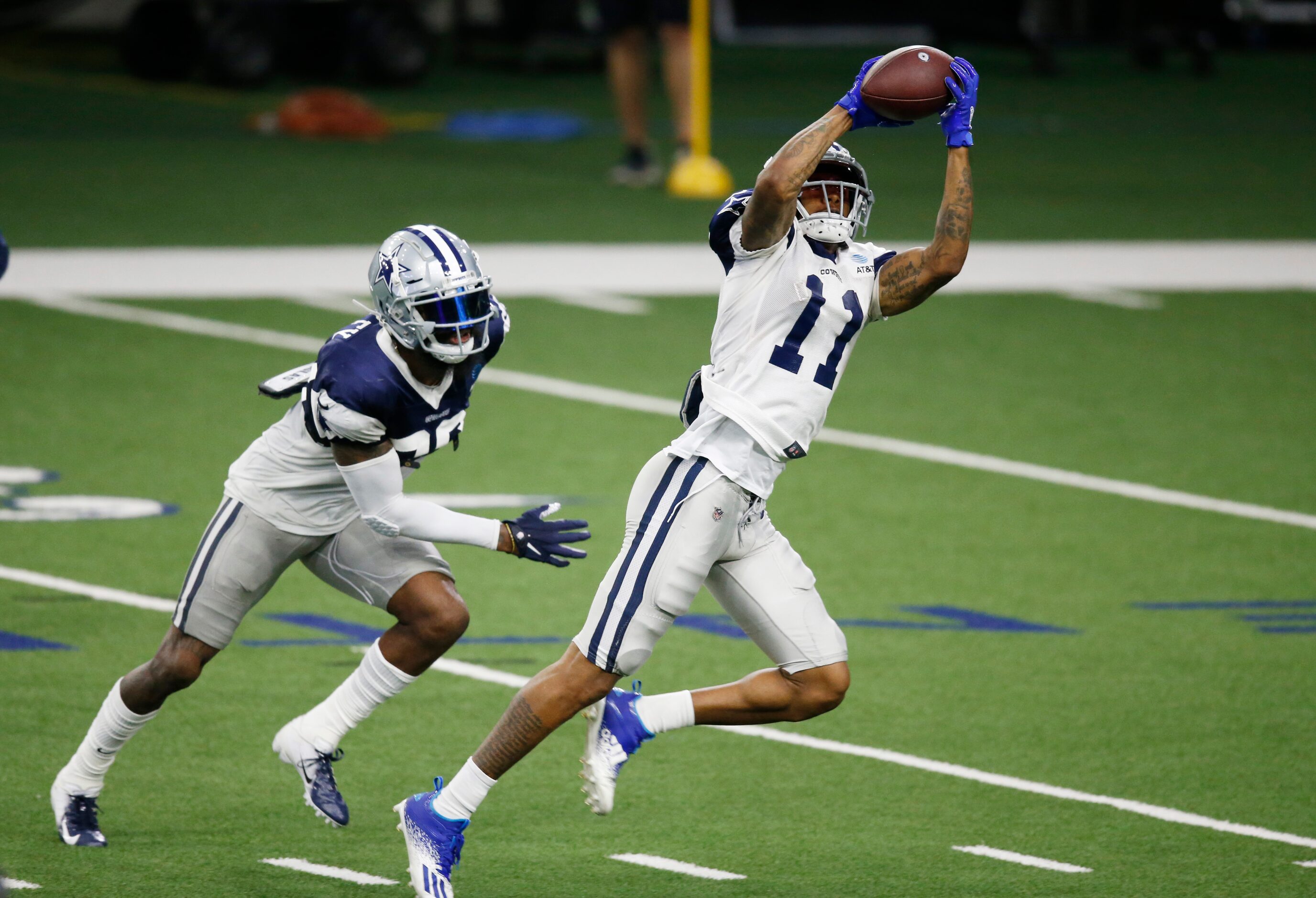 Dallas Cowboys wide receiver Cedrick Wilson (11) catches a pass in front of Dallas Cowboys...