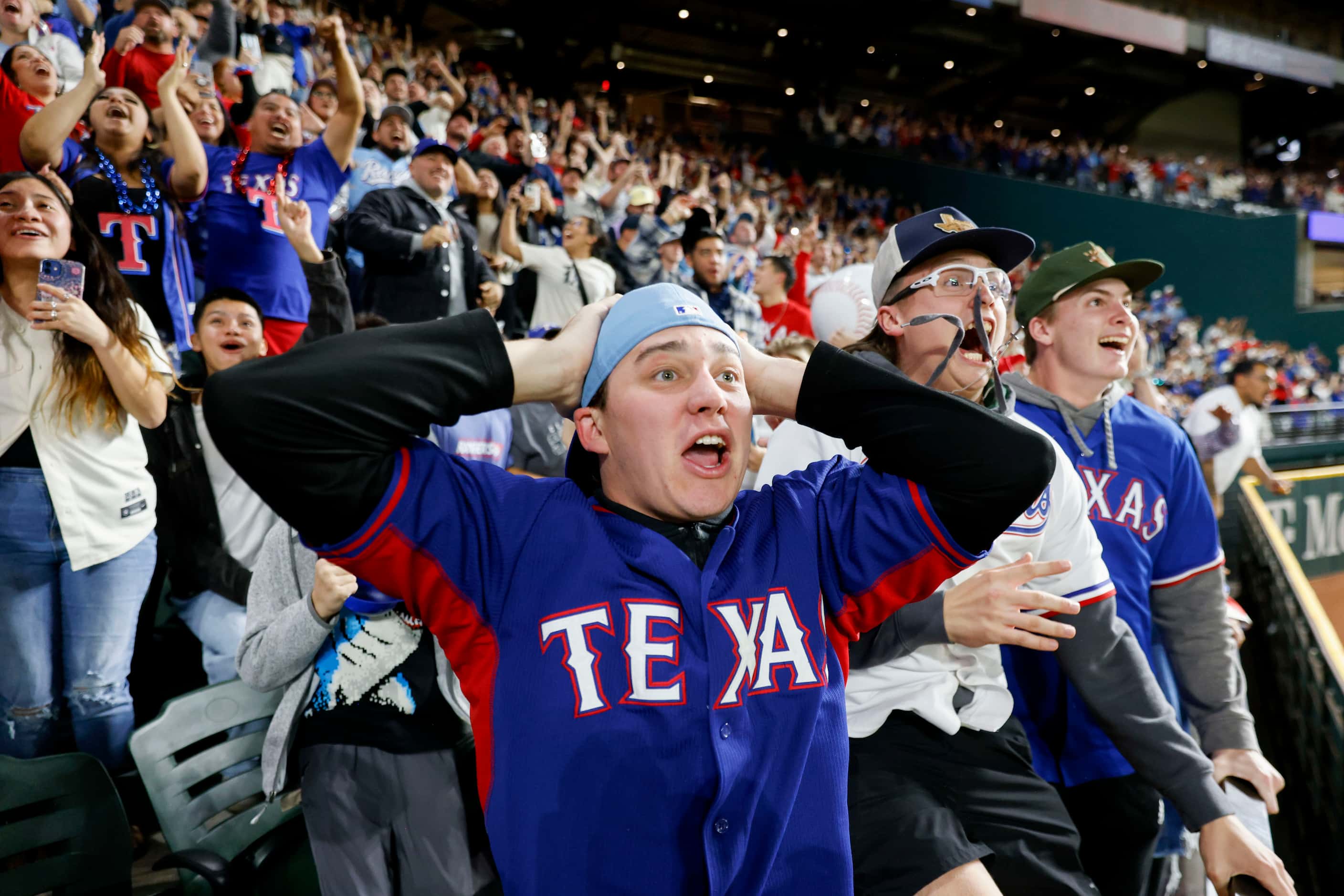 Texas Rangers fans reacts to Marcus Semien’s home run during the ninth inning of World...