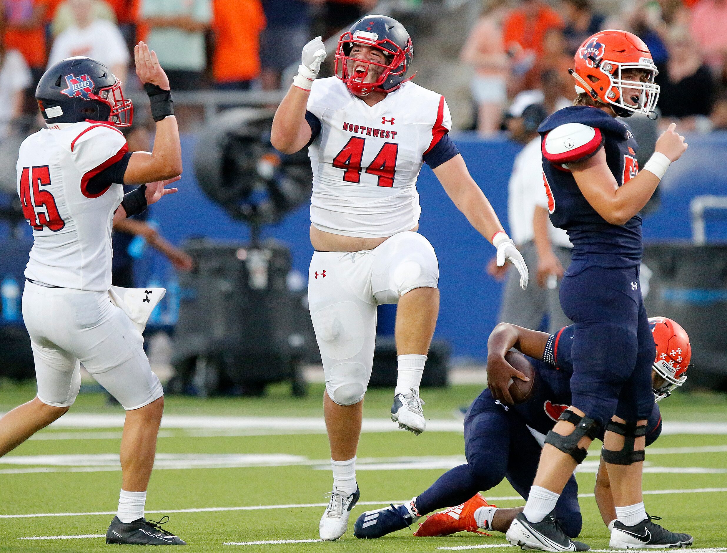 Northwest High School defensive lineman Jacob Moody (44) celebrates a tackle in the...