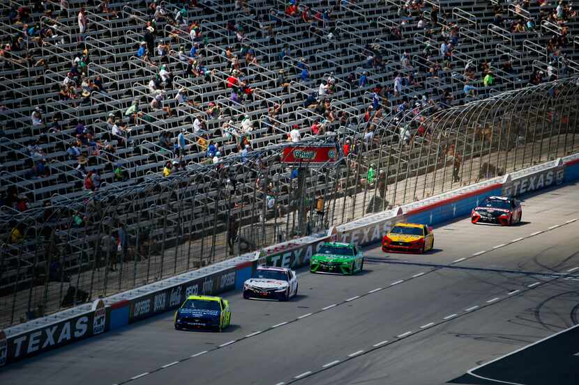 Spaced out fans watch the NASCAR Cup Series O'Reilly Auto Parts 500 race on July 19, 2020 at...