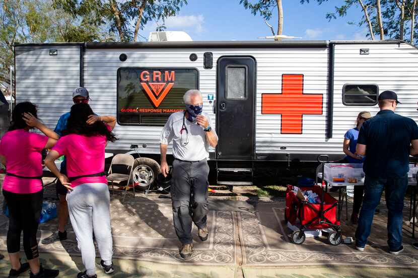 Volunteer doctors and other medical professionals set up outside the Global Response...