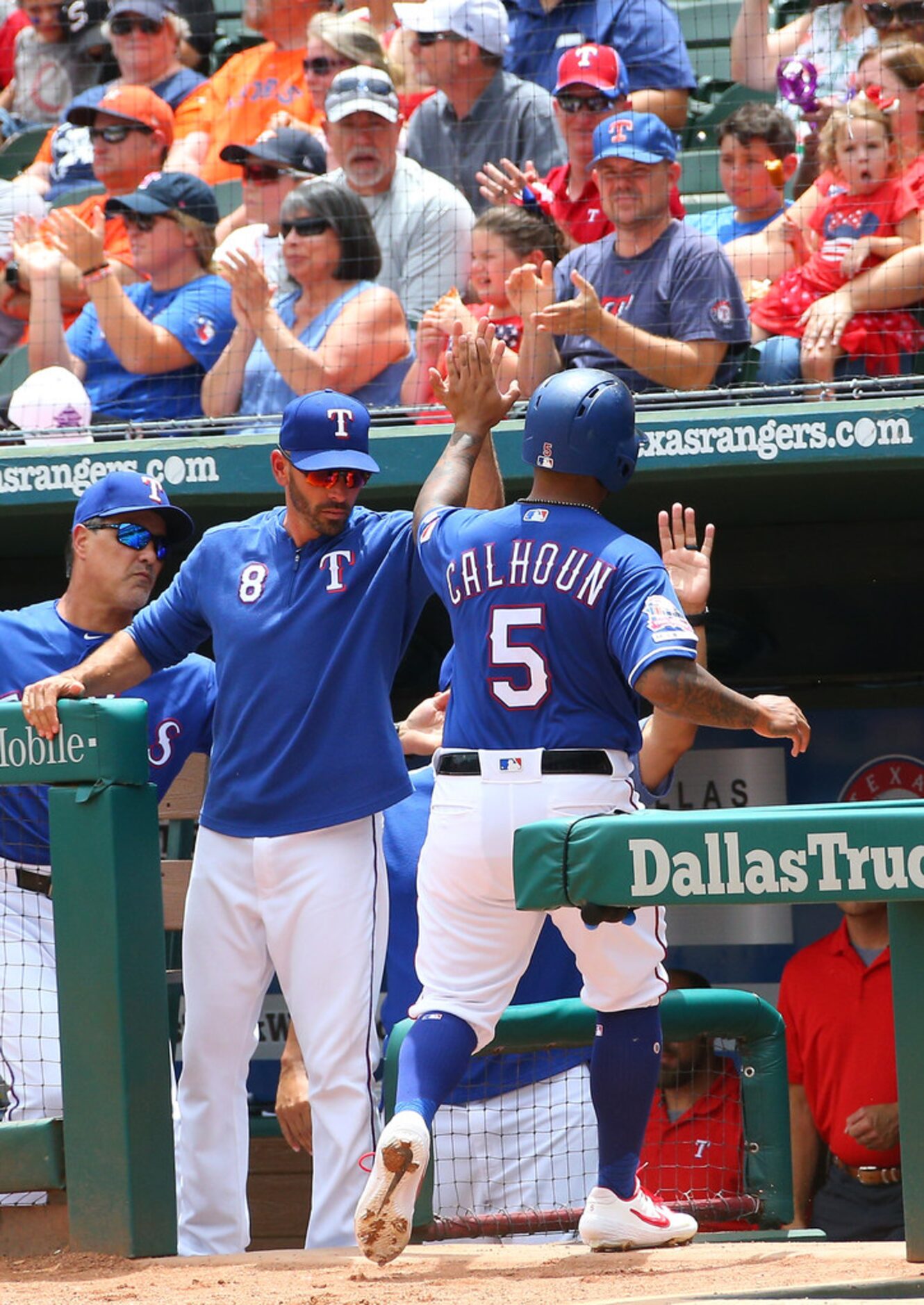 ARLINGTON, TX - JULY 14: Chris Woodward #8 of the Texas Rangers congratulates Willie Calhoun...