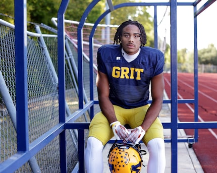 Kailer Pettijohn poses for a photograph at the McKinney High School practice field in...