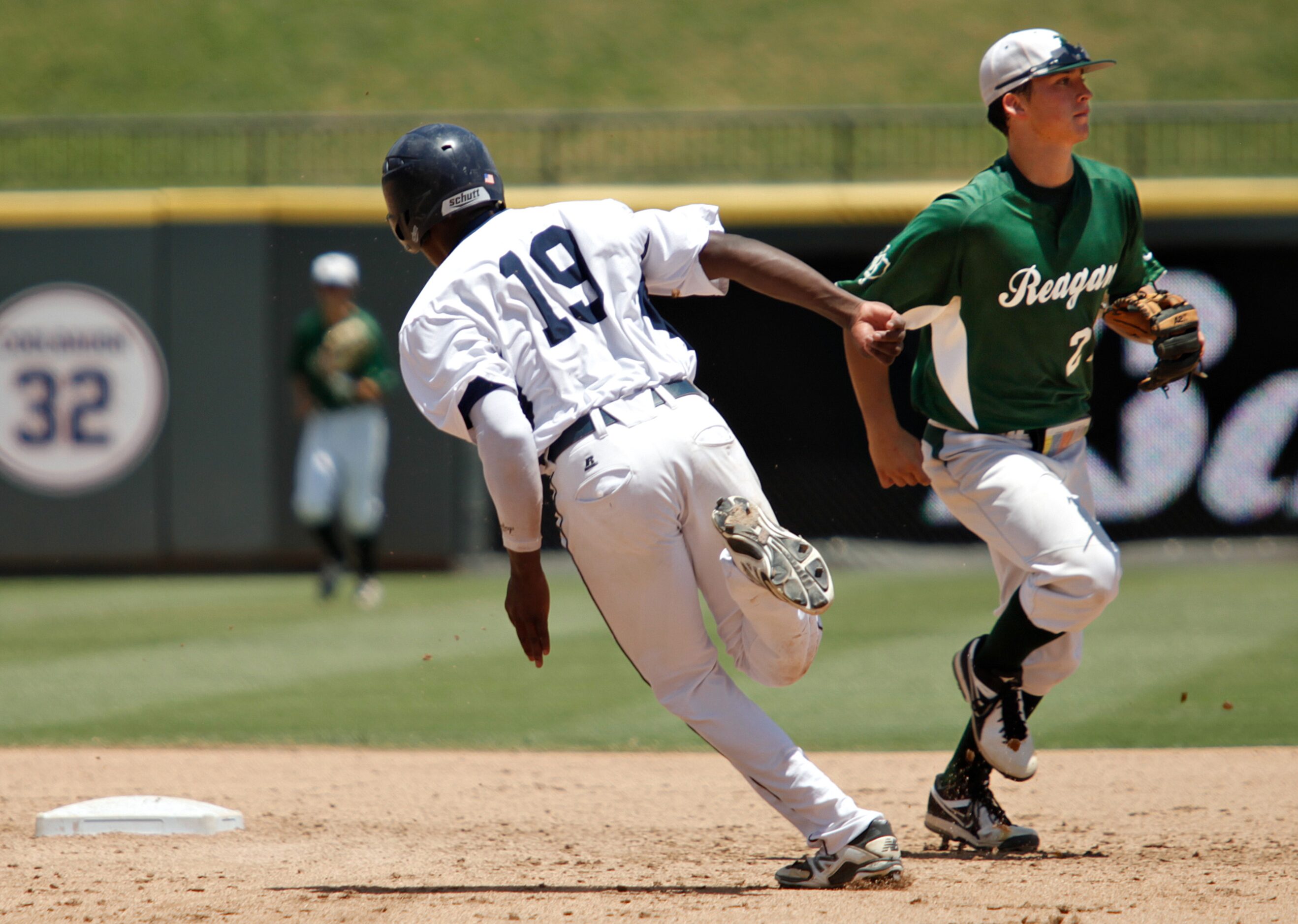 Flower Mound player Jameson Hannah (19) runs past San Antonio Reagan player Andres Sosa (21)...