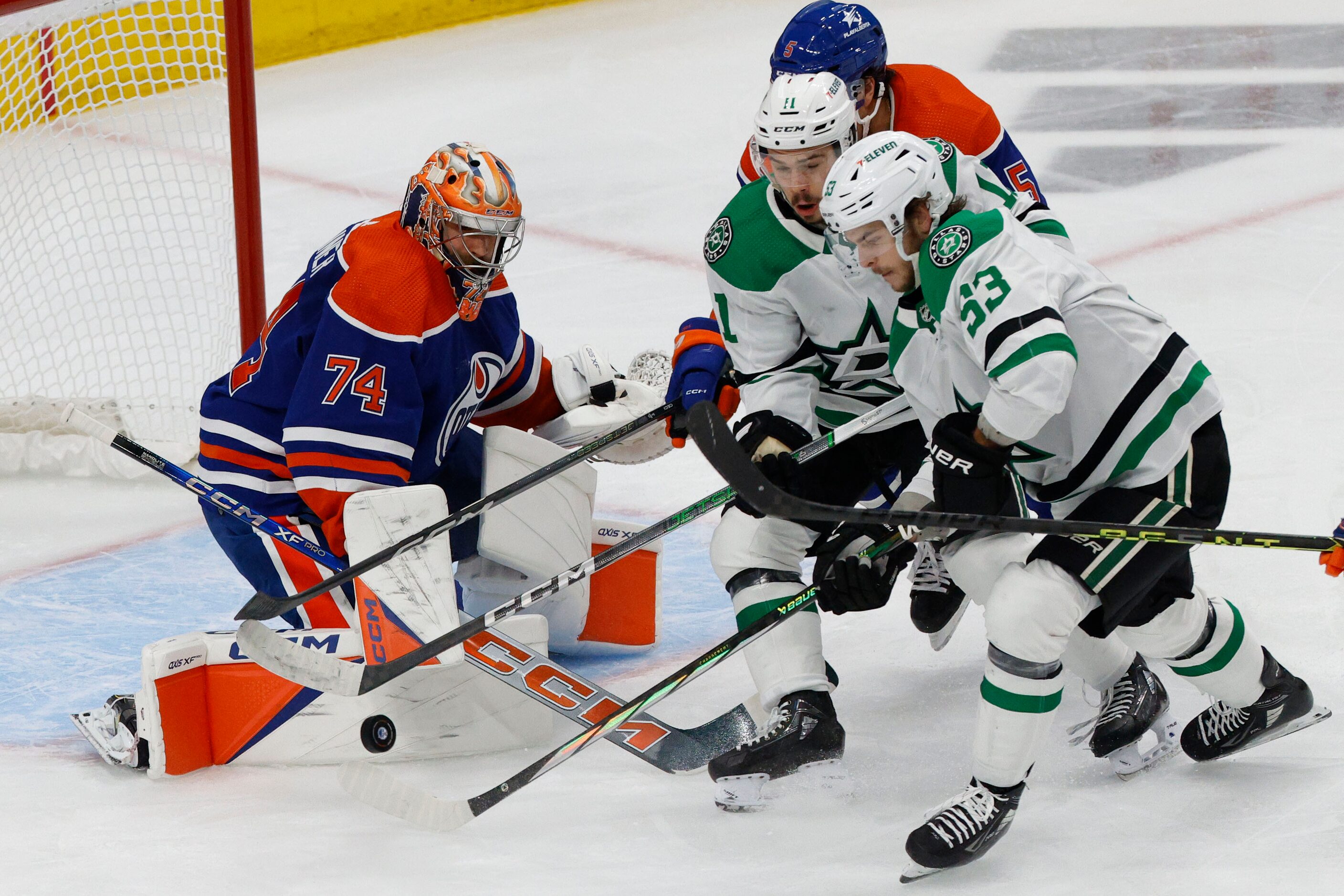 Edmonton Oilers goaltender Stuart Skinner (74) makes a save against Dallas Stars center...