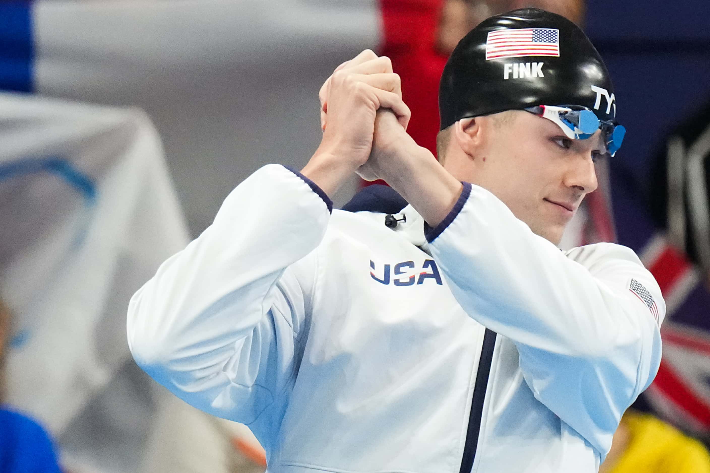 Nic Fink of the the United States is introduced before a men's 100-meter breaststroke...