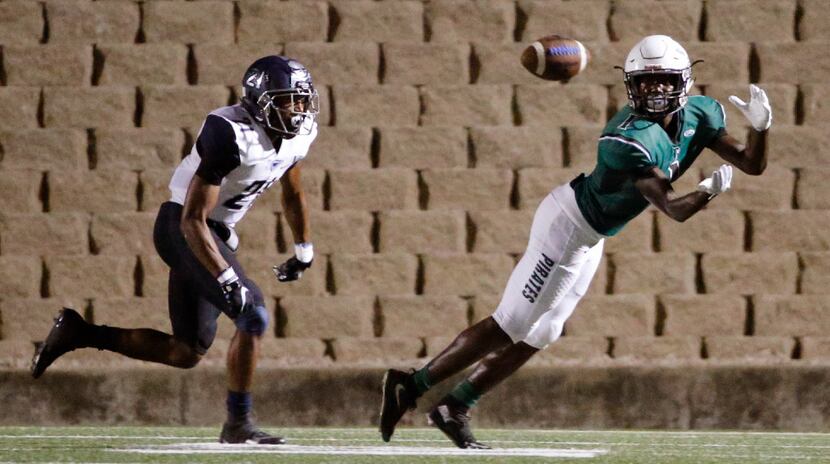 Poteet receiver Cha Cha Corbin (1)  catches a pass in front of Wylie East's Kendrick Davis...