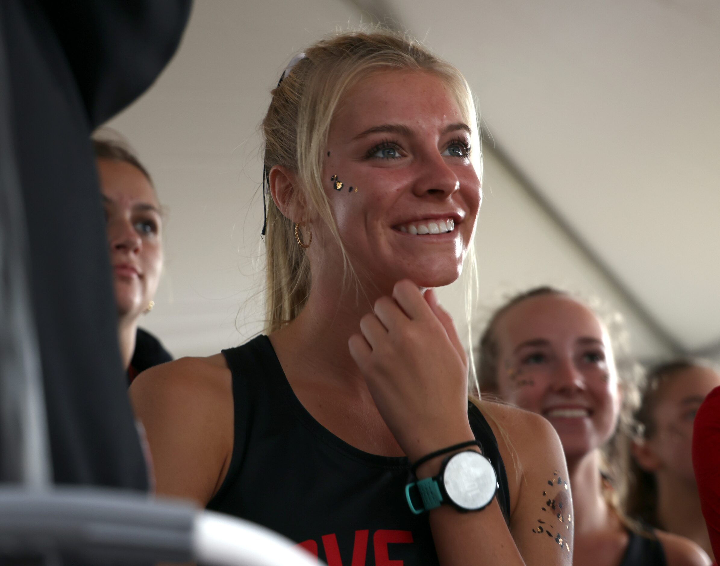 Lucas Lovejoy senior Sara Morefield beams as the announcer on the awards stand lists her...