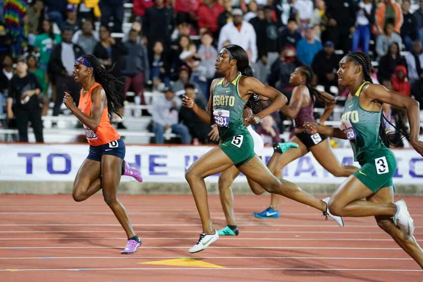 DeSoto's Jayla Hollis (1293) and Rosey Effiong (1291) head to the finish behind winner Laila...