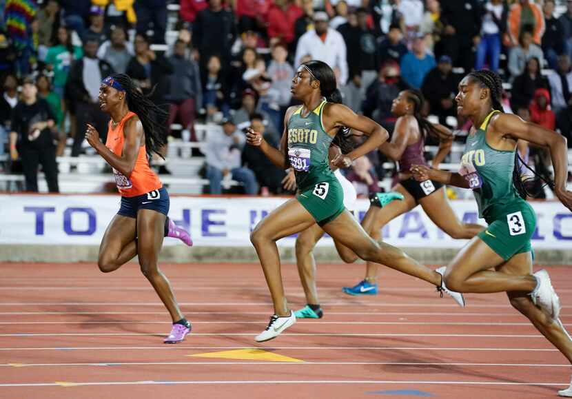 DeSoto's Jayla Hollis (1293) and Rosalie Effiong (1291) head to the finish behind winner ...