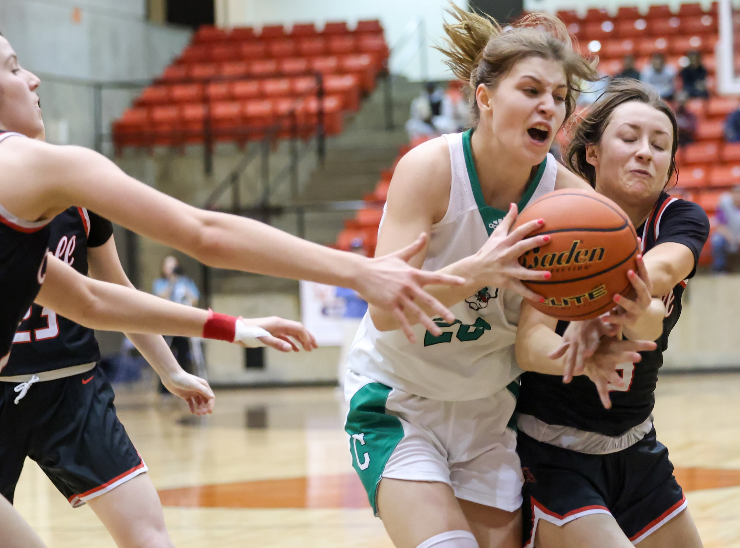 Southlake Carroll senior guard Camryn Tade (20) runs up from behind to steal the ball from...