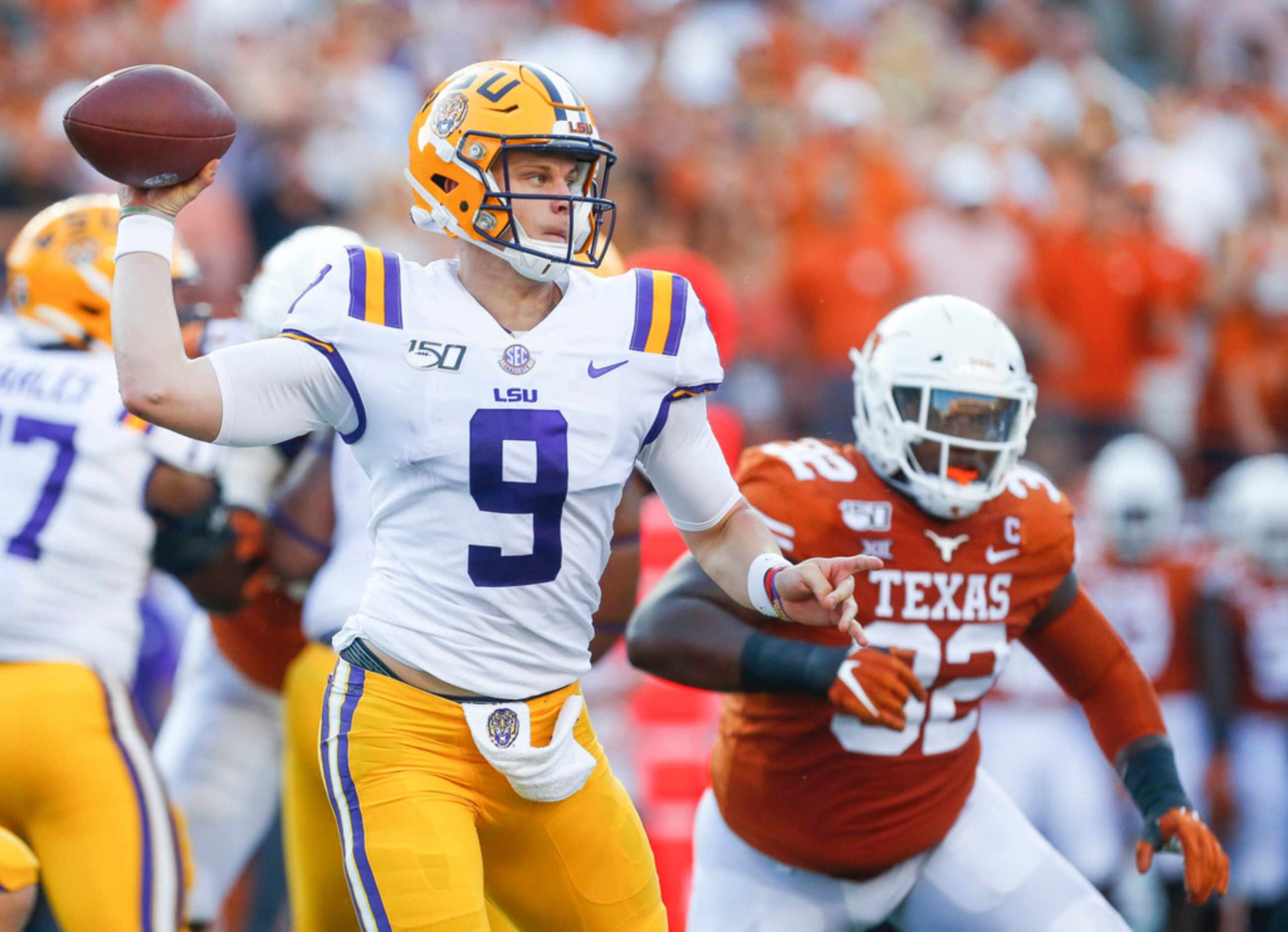 LSU Tigers quarterback Joe Burrow (9) fires off a pass during the first quarter of a college...