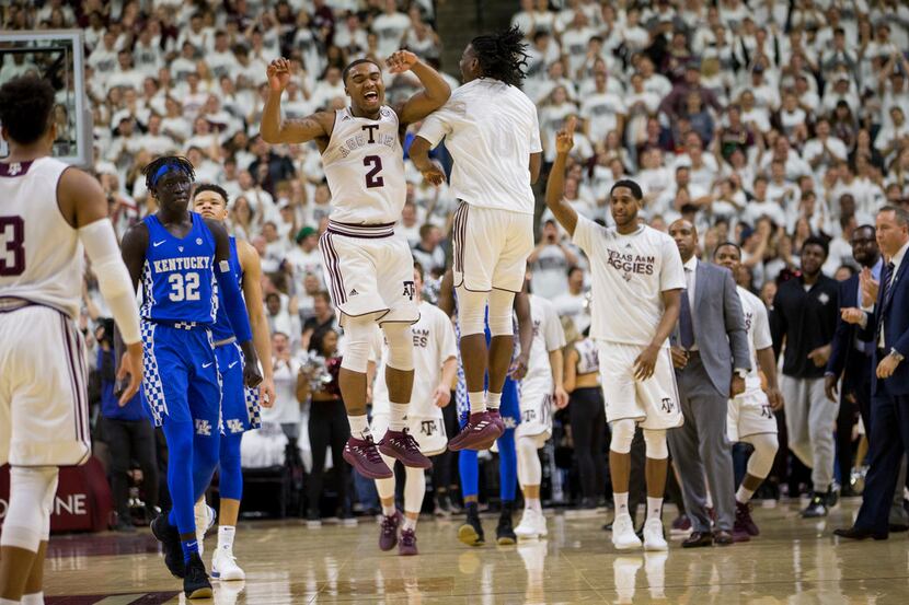 Texas A&M guard TJ Starks (2) reacts with a teammate during a timeout in the second half of...