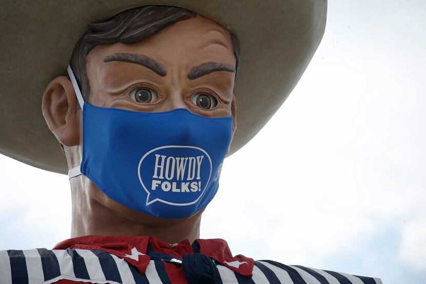 Big Tex sports a "Howdy, folks!" face mask at Fair Park in Dallas on Wednesday, Sept. 16,...