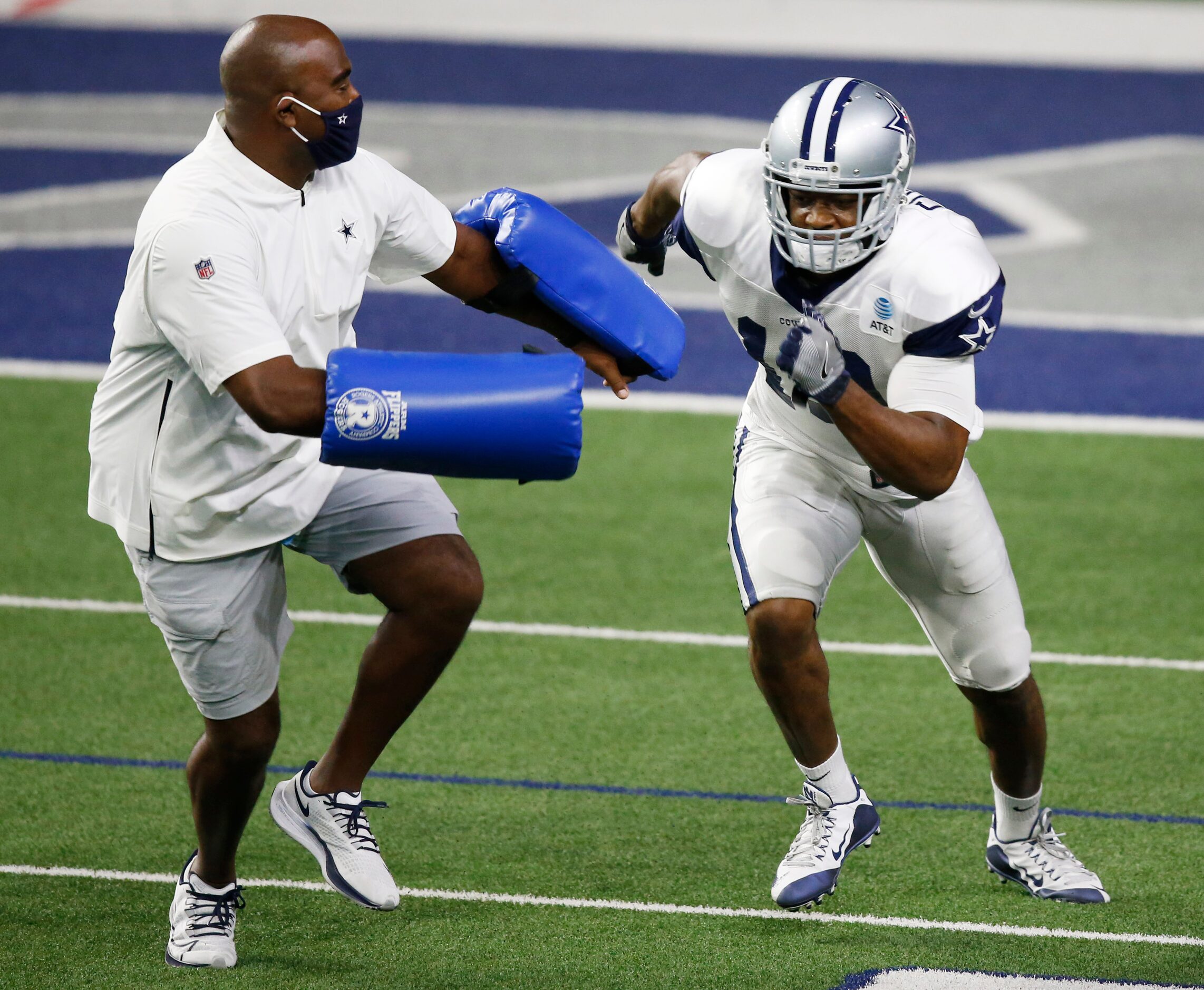 Dallas Cowboys wide receiver Amari Cooper (19) runs through a drill with Dallas Cowboys wide...