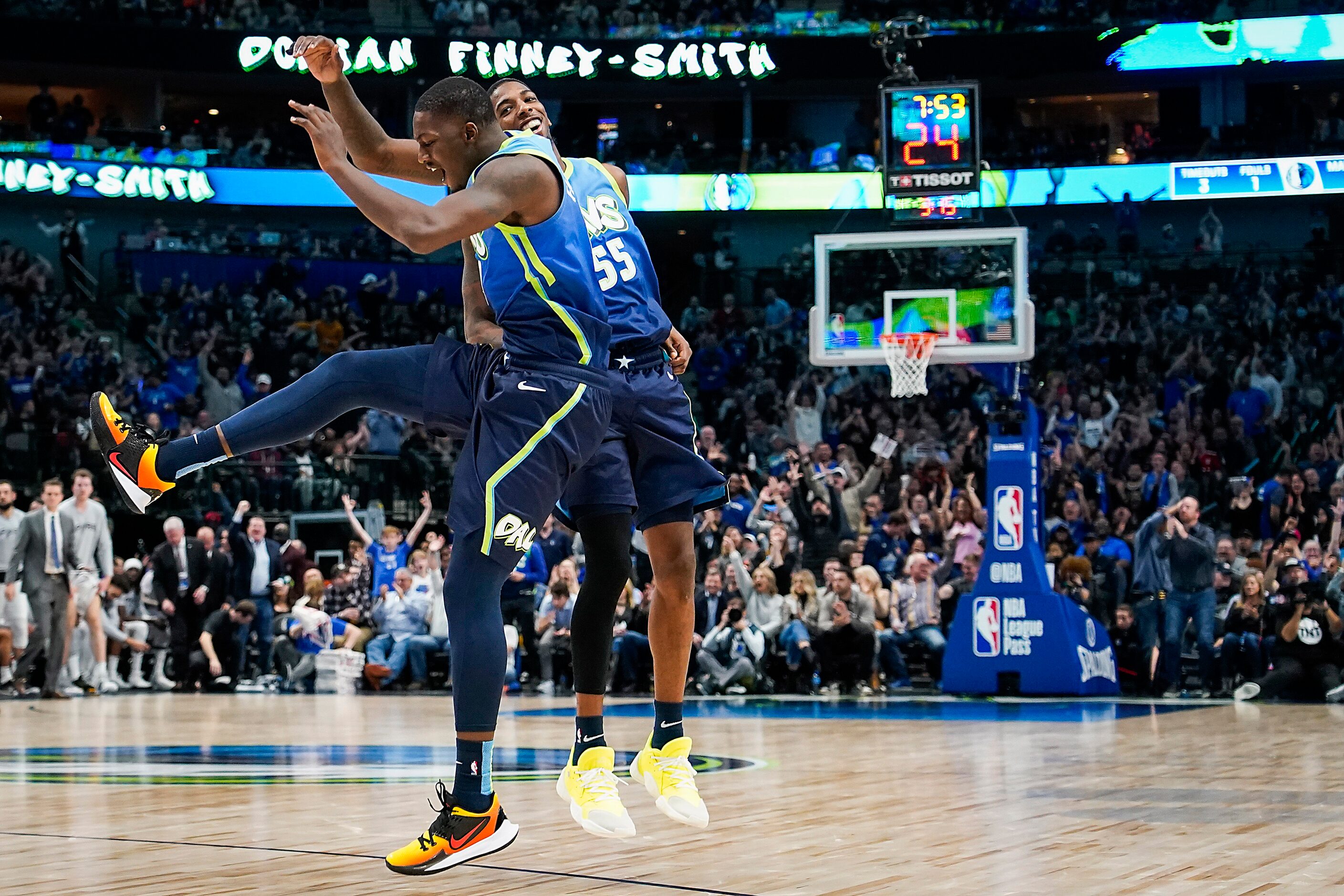 Dallas Mavericks forward Dorian Finney-Smith (10) celebrates making a 3-pointer with guard...