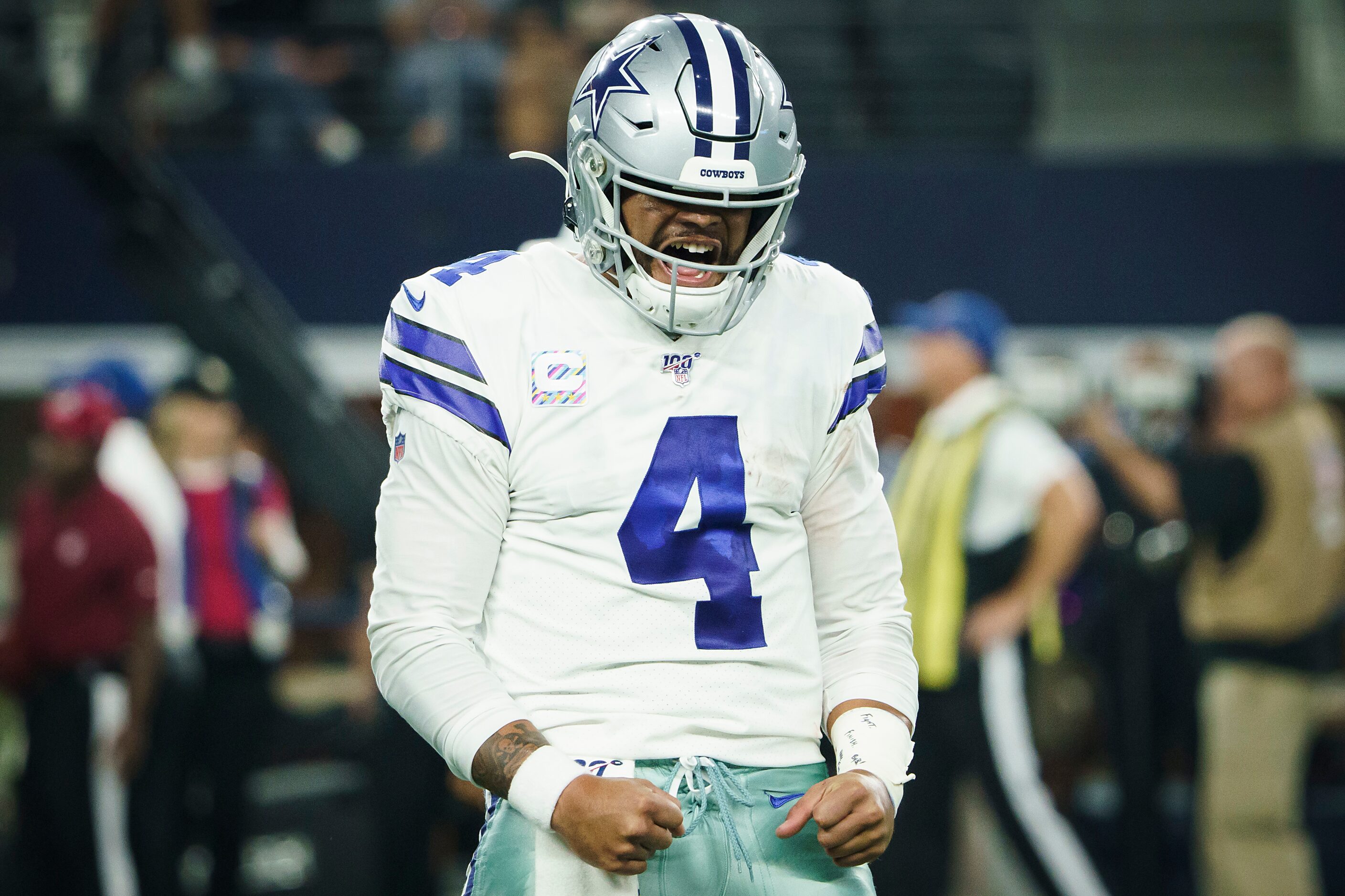 Dallas Cowboys quarterback Dak Prescott (4) celebrates after throwing a touchdown  pass to...