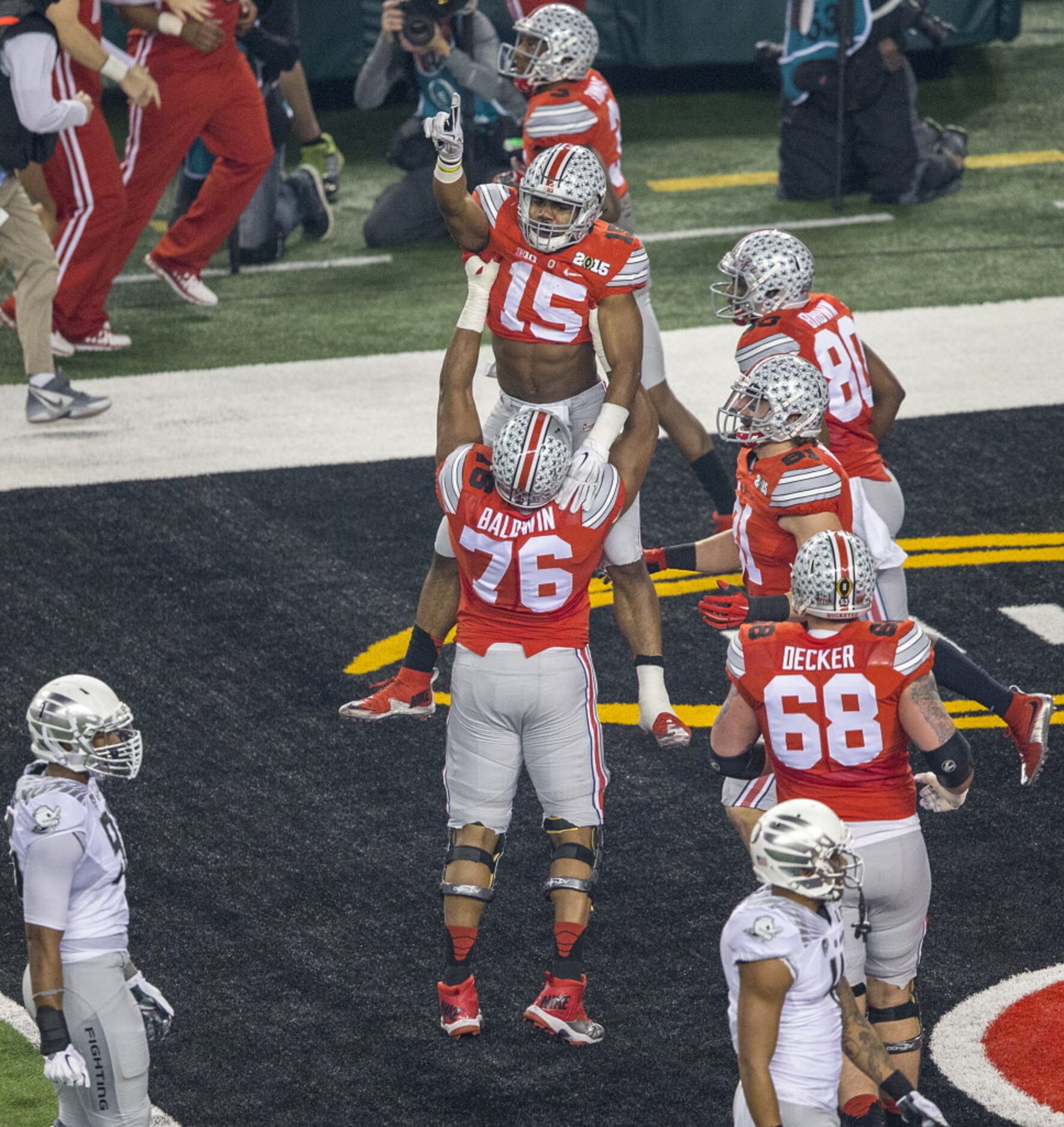 Ohio State Buckeyes running back Ezekiel Elliott (15) celebrates with offensive lineman...