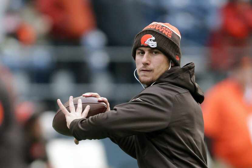 In this Dec. 20, 2015, file photo, Cleveland Browns quarterback Johnny Manziel warms-up...